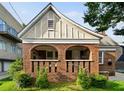 Quaint brick home featuring an inviting covered porch with classic archways at 563 Ralph Mcgill Ne Blvd, Atlanta, GA 30312