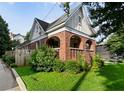 Attractive brick home featuring an arched porch and a neatly manicured lawn at 563 Ralph Mcgill Ne Blvd, Atlanta, GA 30312