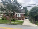 Cozy brick home with well-maintained front lawn and private driveway at 563 Ralph Mcgill Ne Blvd, Atlanta, GA 30312