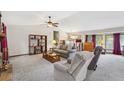Bright living room featuring neutral-toned furniture, vaulted ceilings, and natural light at 1159 Midland Nw Dr, Acworth, GA 30102