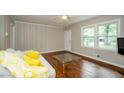 Bright living room with hardwood floors, neutral walls and a sun-filled window at 123 Arnold Pl, Jonesboro, GA 30236