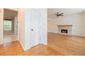 Bright living room with hardwood floors, fireplace, and ample natural light streaming through windows at 2427 Camata, Marietta, GA 30066