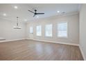Open-concept living space showcasing hardwood floors, bright windows, and a neutral color palette at 907 Agate Ln, Lawrenceville, GA 30043