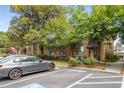 Exterior view of the complex with ample parking at 115 Biscayne Nw Dr # E3, Atlanta, GA 30309