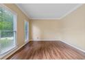 Spacious, bright living room with hardwood floors and large windows at 3355 Golfe Links Dr, Snellville, GA 30039