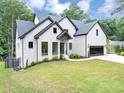 Beautiful two-story house with a well-maintained lawn and modern architectural design at 3562 Clubland Dr, Marietta, GA 30068