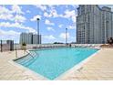 Rooftop pool with lounge chairs providing a luxurious outdoor space with city views at 3324 Peachtree Ne Rd # 1604, Atlanta, GA 30326