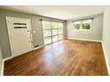 Inviting living room featuring beautiful hardwood floors and ample natural light, creating a warm atmosphere at 813 Crockett Ct, Decatur, GA 30033
