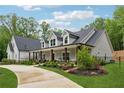 Charming two-story home with a covered porch and professionally landscaped front yard at 540 Byrd Mountain Ln, Canton, GA 30114