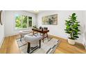 Bright home office with hardwood floors, a neutral rug, and a large window at 6175 River Shore Pkwy, Atlanta, GA 30328