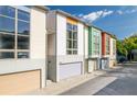Modern townhomes with clean lines, large windows, and individual garages in a vibrant neighborhood at 1271 Mackintosh Nw Park # 30, Atlanta, GA 30318