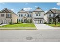 Beautiful two-story home with a manicured lawn, long driveway and welcoming curb appeal at 4189 Brookmont Way, Auburn, GA 30011