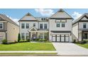 Beautiful two-story home with a manicured lawn, long driveway and welcoming curb appeal at 4189 Brookmont Way, Auburn, GA 30011