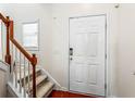 Bright foyer with stairs, featuring wood accents and a white door at 2555 Flat Shoals Rd # 2006, Atlanta, GA 30349