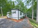 Home exterior featuring fresh paint, a small front porch and an established yard at 337 Theodore Cox Cir, Canton, GA 30114