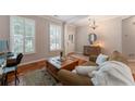 Inviting living room with hardwood floors, plantation shutters, and stylish decor at 475 Chippenham Ct, Alpharetta, GA 30005