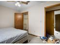 This bedroom showcases a closet with shelving and doorway that leads to other rooms, but needs some tidying and work at 1587 Cronic Town Rd, Auburn, GA 30011