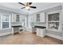 Bright office space with built-in cabinets, desk, and a cozy window seat at 326 Brownstones Ne Cir, Atlanta, GA 30312