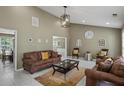 Comfortable living room with high ceilings, modern lighting, and tiled floors at 5900 Union Woods Way, Union City, GA 30291