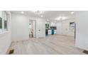 Open floor plan with new floors, fixtures, and access to the kitchen and bathroom at 4443 Flat Shoals Pkwy, Decatur, GA 30034
