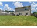 Expansive backyard with lush green grass and privacy fence, perfect for outdoor activities at 15 Regal Ln, Covington, GA 30016