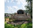 A Streamwood Manor community entrance sign on a sunny day, surrounded by greenery at 15 Regal Ln, Covington, GA 30016