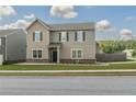 Charming two-story home features a welcoming front porch and beautifully landscaped front yard at 15 Regal Ln, Covington, GA 30016