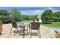 Relaxing patio view with comfortable seating and beautiful landscaping at 215 Settindown Ct, Roswell, GA 30075