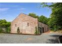 Striking brick building with unique architectural details, stylish black windows and professional landscaping at 538 Main St, Palmetto, GA 30268