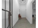 Bright hallway with polished concrete floors and a stylish light fixture at 538 Main St, Palmetto, GA 30268