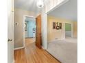 Hallway with wood floors leading to other rooms in the house at 2117 Chestnut Hill Circle Cir, Decatur, GA 30032
