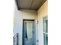 Entryway door to unit #22, gray exterior, secure lock system, and access to natural light at 238 Walker Sw St # 22, Atlanta, GA 30313