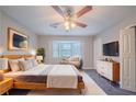 Serene main bedroom featuring soft lighting, a bay window, and stylish furnishings for a peaceful retreat at 446 Jaywood Dr, Stone Mountain, GA 30083
