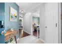 Inviting entryway with tiled floors, wall art, and view into the living room and bedroom at 719 Mcgill Park Ne Ave, Atlanta, GA 30312
