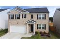Beautiful two-story home with brick facade, two car garage, and inviting front entrance at 2159 Redfern Rd, Dacula, GA 30019
