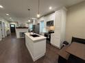 Modern kitchen with white cabinets, stainless steel appliances, and a center island at 2148 Martin Luther King Jr Sw Dr, Atlanta, GA 30310