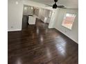 Hardwood floors throughout with large windows providing natural light in the open concept space at 4356 Rockbridge Rd, Stone Mountain, GA 30083