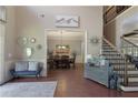 A foyer with hardwood floors offering views of the staircase and dining room at 4547 Meadow Green Nw Ln, Acworth, GA 30101