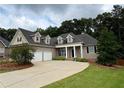 Attractive exterior showcasing a two-car garage and a well-maintained front yard at 237 Shockley Way, Dallas, GA 30157