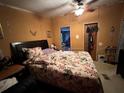 View of the bedroom showing bed, pillows, bedside table, and ceiling fan at 25 Dogwood Dr Nw, Cartersville, GA 30121