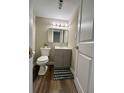 Cozy bathroom featuring a vanity, mirror, and toilet with a patterned rug at 405 Fairburn Sw Rd # 231, Atlanta, GA 30331