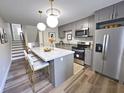 Updated kitchen showcasing stainless steel appliances and a kitchen island with barstool seating at 405 Fairburn Sw Rd # 231, Atlanta, GA 30331