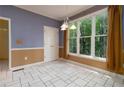 Cozy breakfast nook featuring tile flooring and large windows offering scenic views at 5287 Wild Indigo Way, Acworth, GA 30102