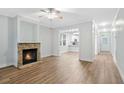 Bright living room featuring a stone fireplace, hardwood floors, and an open layout at 1283 Mercer, East Point, GA 30344