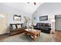 Comfortable living room with high ceilings, plush sofas, and a decorative area rug at 325 Harris Loop, Dallas, GA 30157
