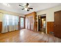 Bright bedroom featuring hardwood floors, closet space, and natural light at 1191 S Burnt Hickory Rd, Douglasville, GA 30134
