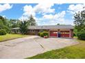 Spacious brick home with an attached two-car garage and large driveway at 1191 S Burnt Hickory Rd, Douglasville, GA 30134