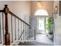 Inviting entryway features decorative tile flooring, arched doorway and wrought iron staircase at 40 Legend Creek Chase, Douglasville, GA 30134