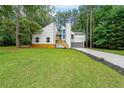 Renovated two story home with white paint, side entry garage and gorgeous front yard at 2189 Spear Point Dr, Marietta, GA 30062