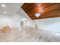 Bright living room with hardwood floors, modern lighting, and stylish wood ceiling feature at 2189 Spear Point Dr, Marietta, GA 30062